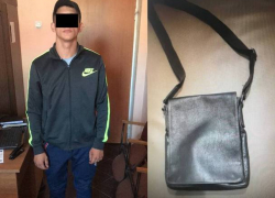 Оставленная в автомобиле сумка привлекла внимание грабителя