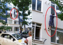 На Рышкановке "человек-паук" в одном лишь халате карабкался по стене многоэтажки